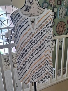 NY & co Sleeveless Chain-Print Split-Neck Top in White with Black & Gold Chains.